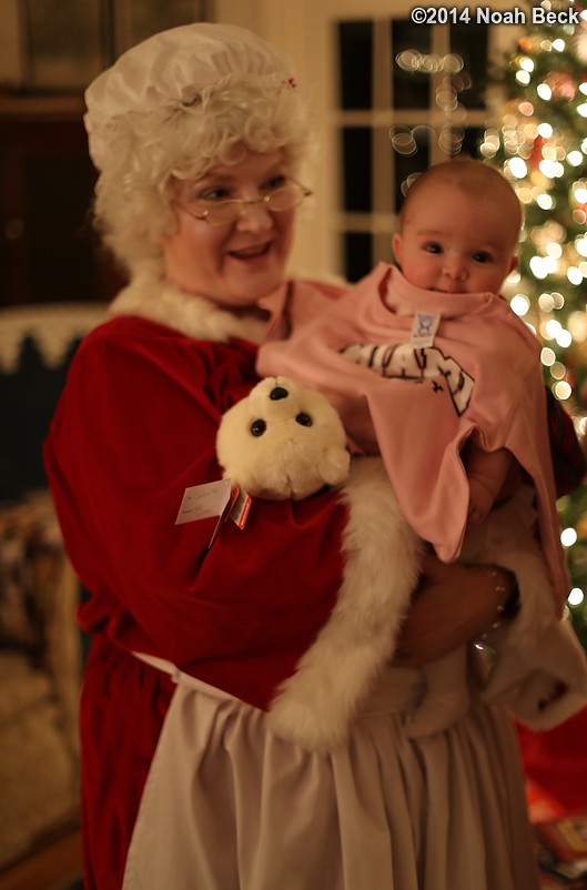 December 26, 2014: Catherine models a new college sweatshirt while being held by Mrs. Claus