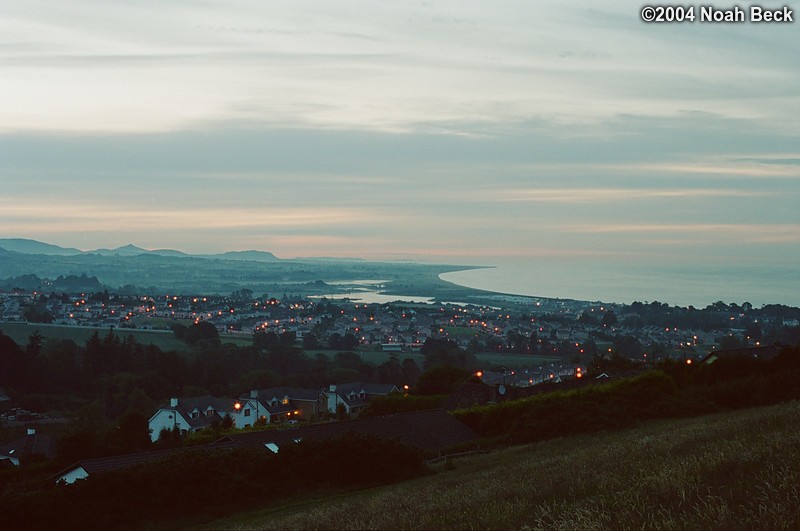 July 6, 2004: I climbed up the hill behind our B&amp;B around dusk (about 10 pm) and took this picture of the town of Wicklow.