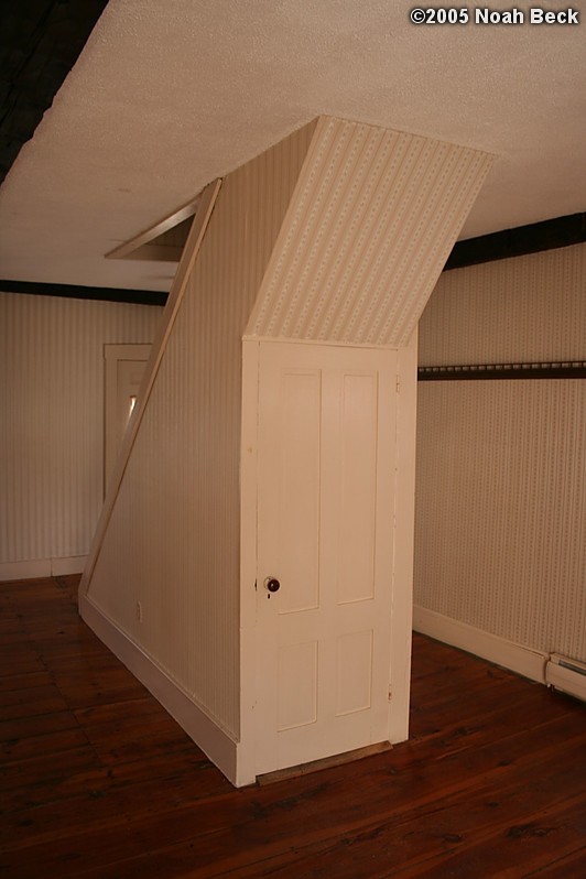 November 1, 2005: The door leads down to the cellar.  The stairway on the other side leads up to two bedrooms.
