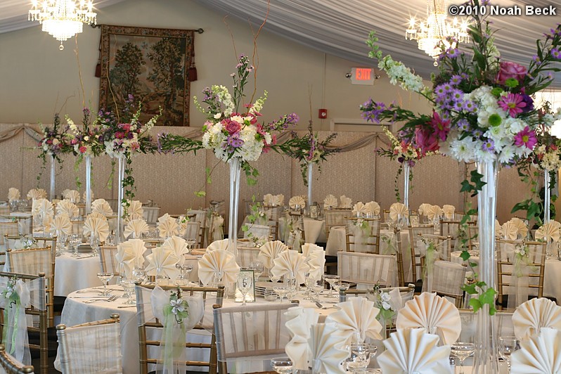 June 26, 2010: Elevated floral centerpieces with tables set