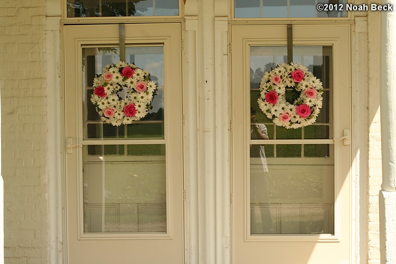 June 2, 2012: Floral wreaths on the front doors of the house