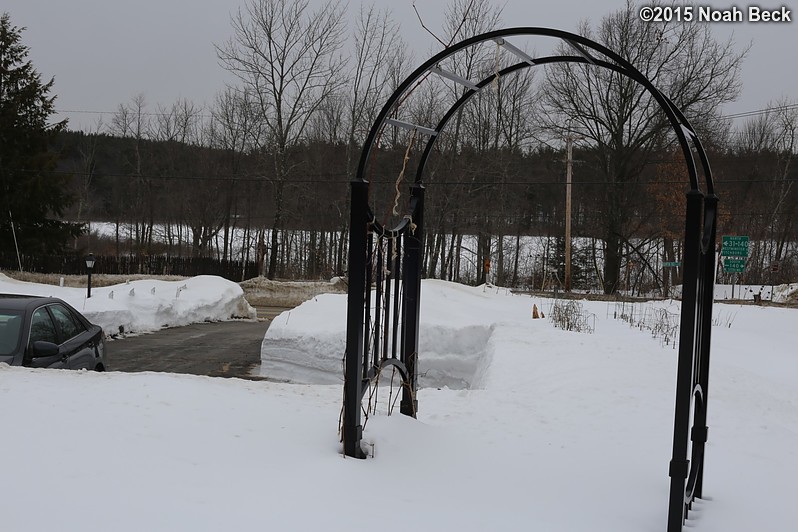 March 1, 2015: Looking down on the front driveway and garden arch after a week of no new snow