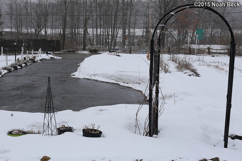 March 28, 2015: Looking down on the front driveway and garden arch after five weeks of no new snow