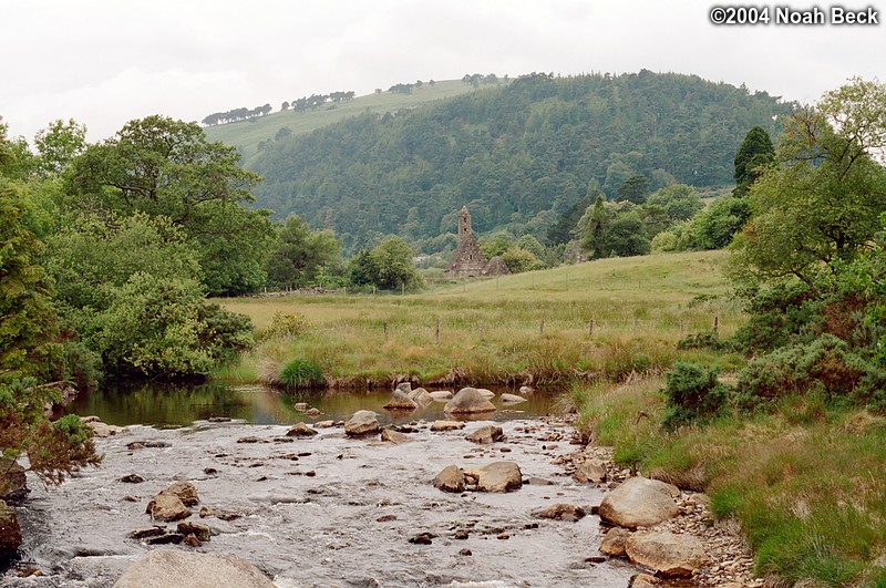 July 7, 2004: Glendalough is a monastic site that was founded in the sixth century. The round tower visible here is one of a few remaining ruins in this scenic valley.