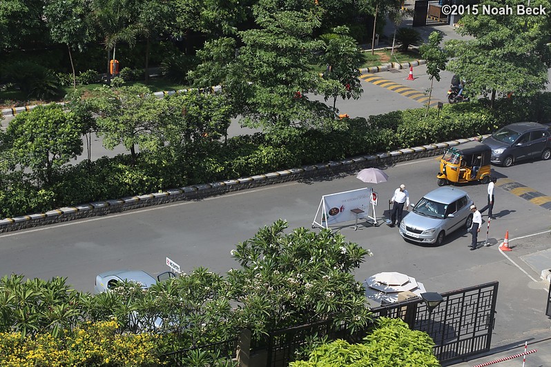 April 24, 2015: Guards checking cars turning into the hotel