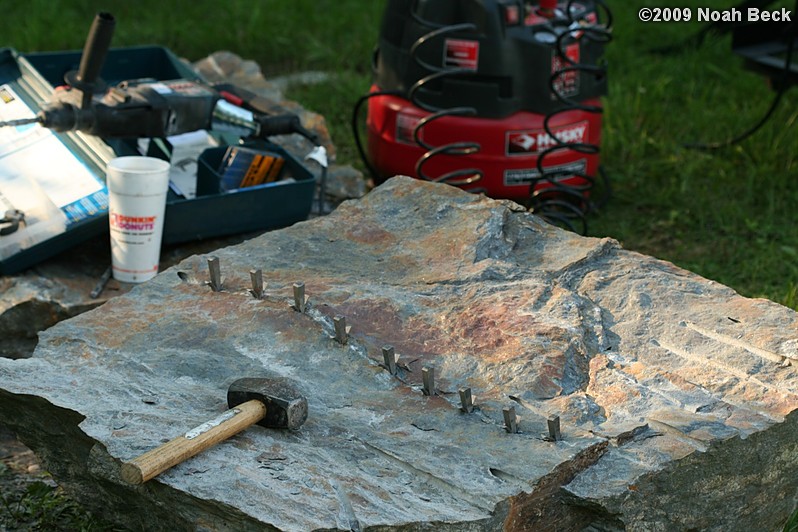 July 10, 2009: Using a hammer drill and feathers and wedges to split up rocks into rock steps