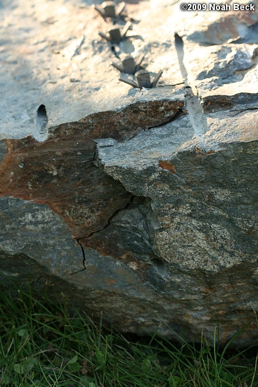 July 10, 2009: Using a hammer drill and feathers and wedges to split up rocks into rock steps