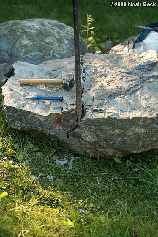 July 10, 2009: Using a hammer drill and feathers and wedges to split up rocks into rock steps