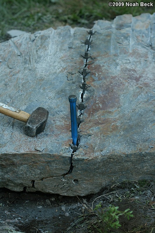 July 10, 2009: Using a hammer drill and feathers and wedges to split up rocks into rock steps