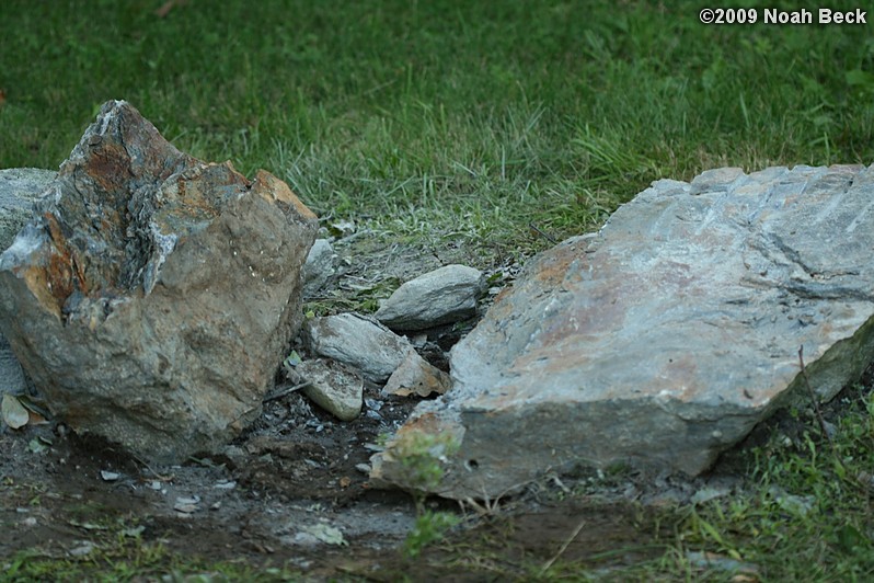 July 10, 2009: Using a hammer drill and feathers and wedges to split up rocks into rock steps