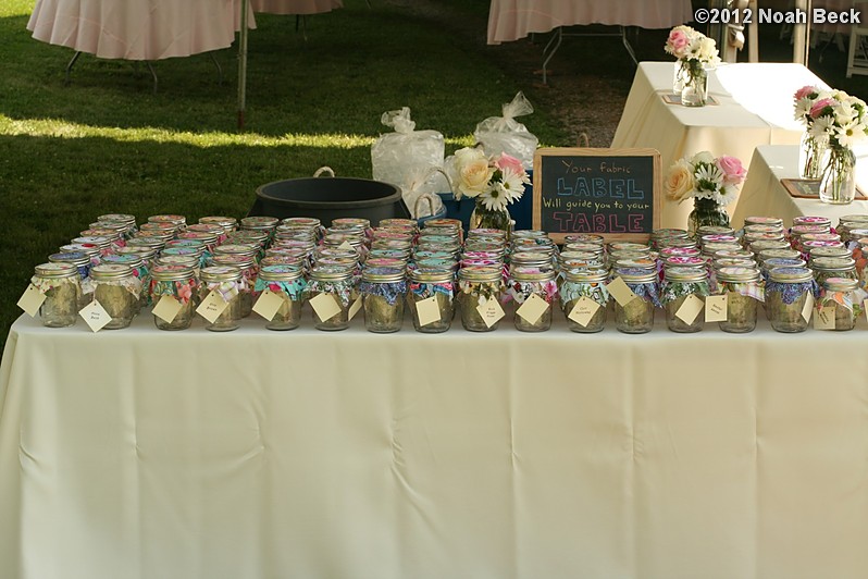 June 2, 2012: Mason jars with fabric swatches for table assignments