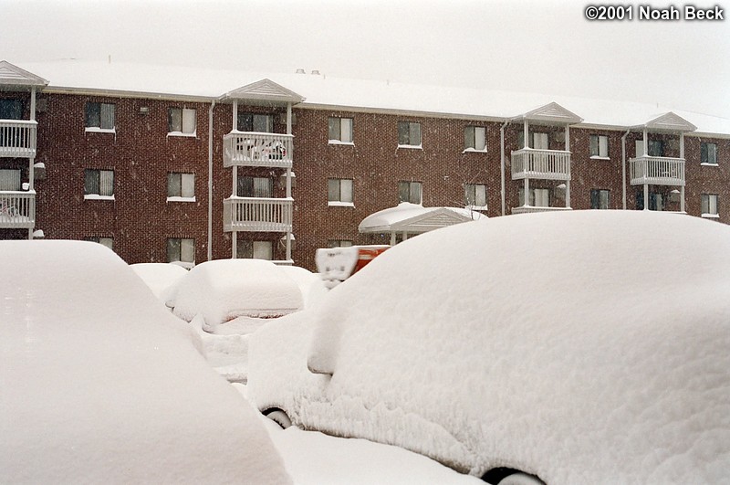March 6, 2001: The morning of the second day of the New England blizzard.  Looking out my bedroom window. Notice the snow is piled up to the top of the car&#39;s tire here.