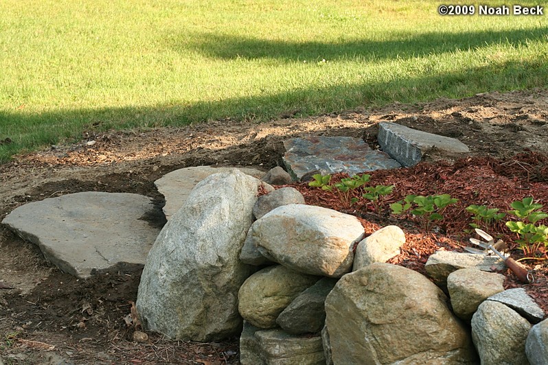 July 19, 2009: New rock steps in place at the end of the rock wall at the top of the driveway