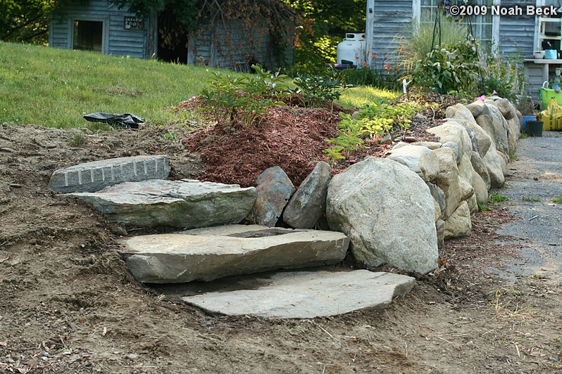 July 19, 2009: New rock steps in place at the end of the rock wall at the top of the driveway