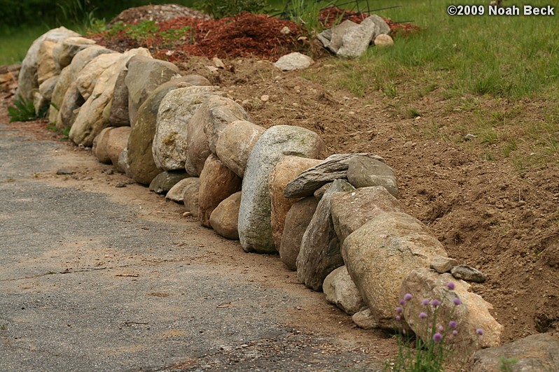 June 3, 2009: New rock wall at the top of the driveway, including a small staircase