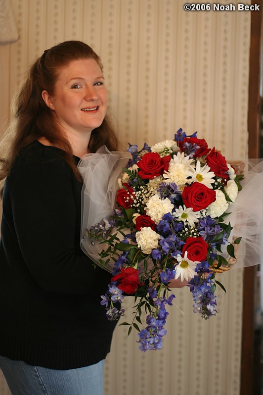January 21, 2006: Rosalind holding a cascade bouquet with Charlotte Roses, daisy poms, white carnations, baby&#39;s breath, and Belladonna Delphinium adorned with fiber optic lights