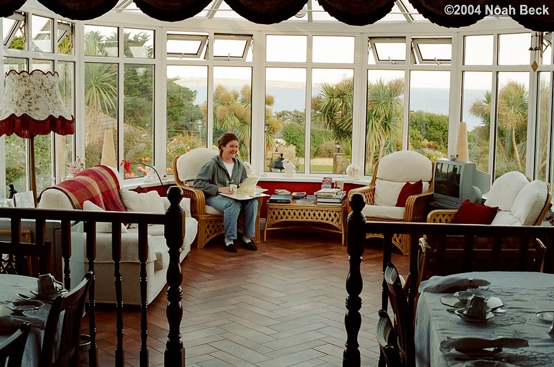 July 5, 2004: Rosalind in her natural habitat -- a large sunroom at Cliff House in Tramore, the B&amp;B we stayed at.