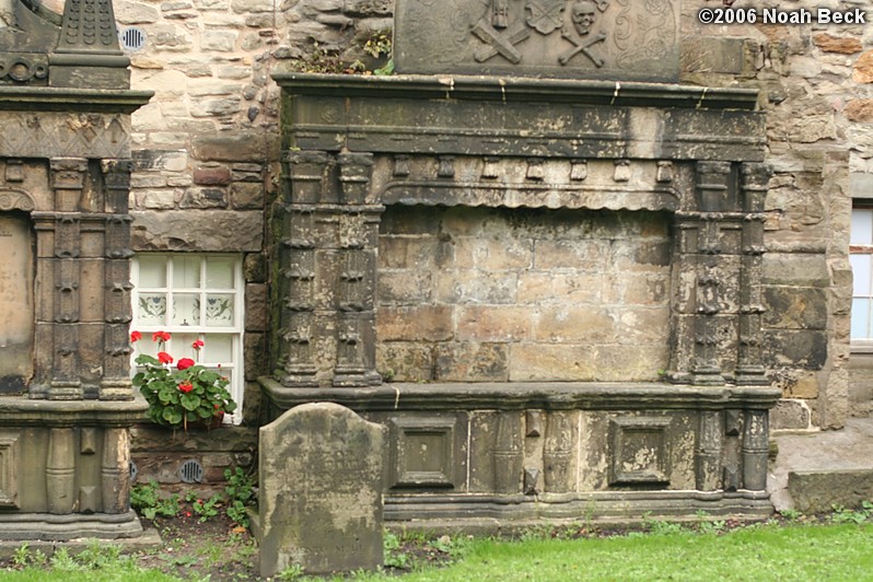 October 24, 2006: Someone&#39;s window and window box between two monuments in old Greyfriars Churchyard.