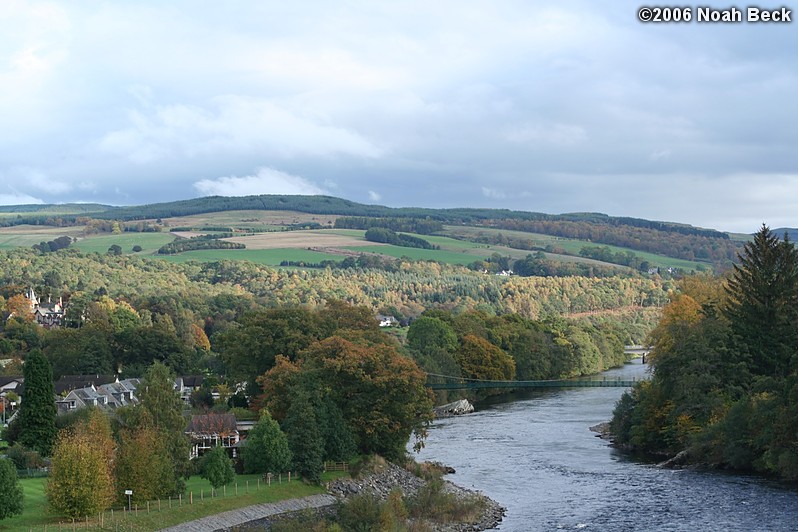 October 21, 2006: View of the hillside and the wee wobbly bridge over the River Tummel from the hydro-electric dam in Pitlochry.