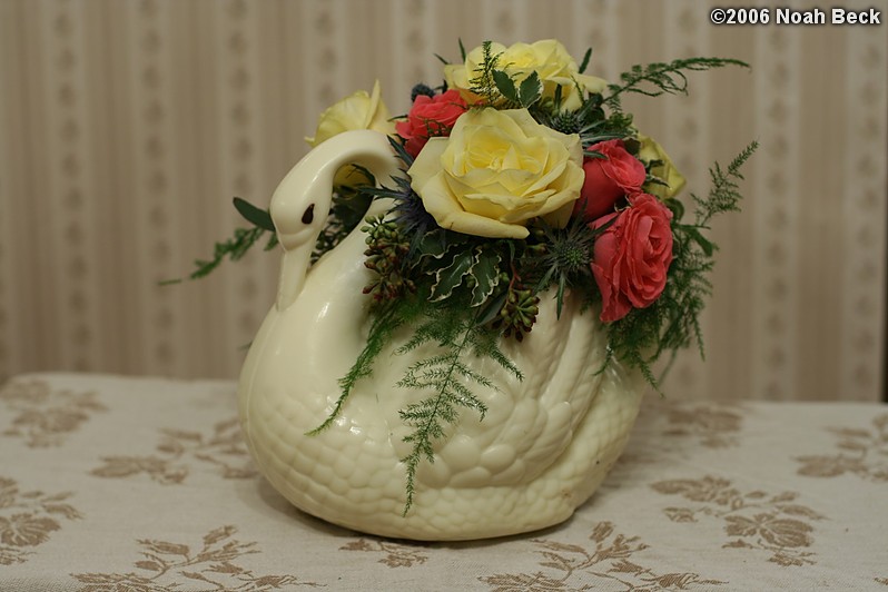 February 1, 2006: White Chocolate Swan centerpiece arrangement with Plumosa Fern, Skyline Roses, Pink Sweetheart Roses, Thistle, and Seeded Eucalyptus
