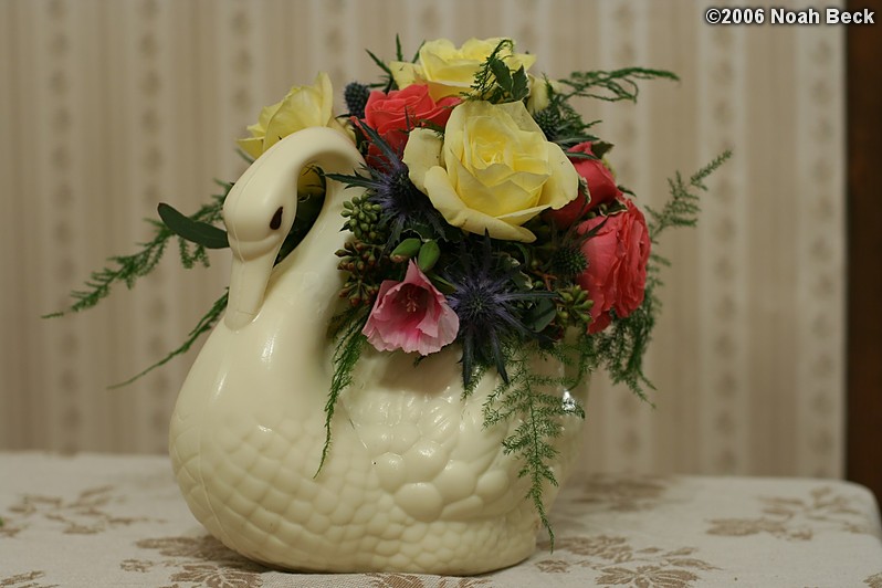 February 1, 2006: White Chocolate Swan centerpiece arrangement with Plumosa Fern, Skyline Roses, Pink Sweetheart Roses, Thistle, and Seeded Eucalyptus