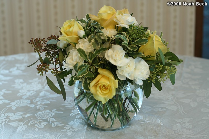 January 29, 2006: Yellow Skyline Roses, white mini-Carnations, and Seeded Eucalyptus in a rose bowl